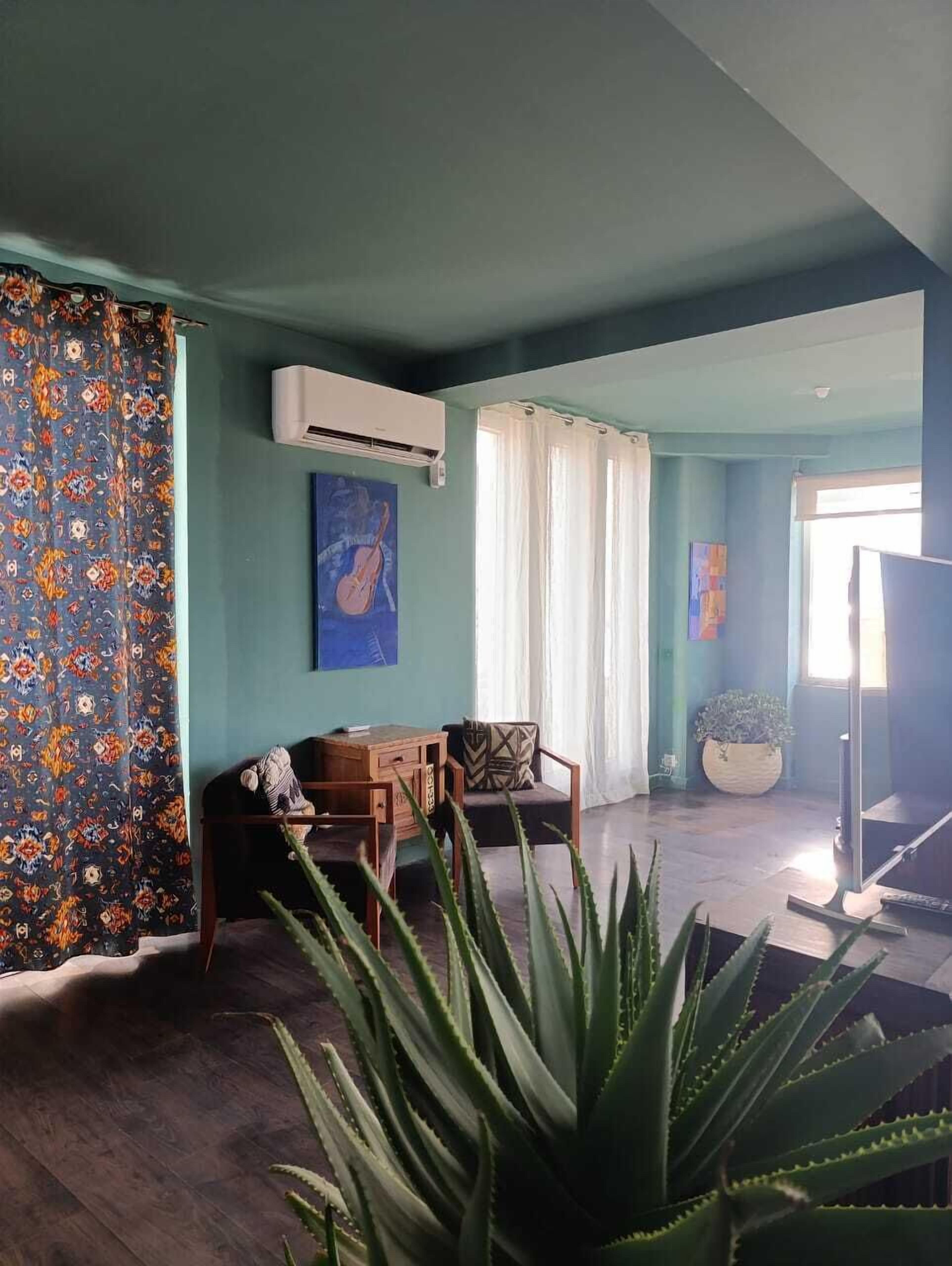 Comfort Apartment, Beach View | Living area | 40-inch flat-screen TV with digital channels