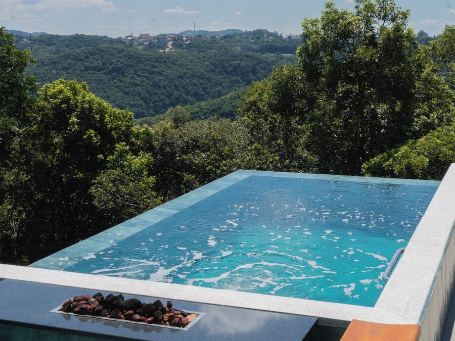 Deluxe Chalet, Lanai, Valley View | Infinity pool | Outdoor pool, pool umbrellas, sun loungers