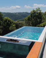 Deluxe Chalet, Lanai, Valley View | Infinity pool | Outdoor pool, pool umbrellas, sun loungers