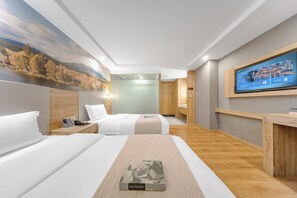 A hotel room with two beds, a flat-screen TV, a painting of a landscape, and a wooden desk.