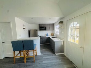 Fridge, microwave, stovetop, coffee/tea maker