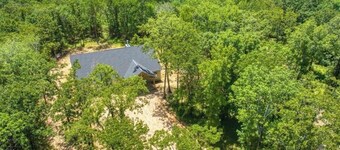 Relax and unwind at this peaceful 2-bedroom, 1-bath cabin off Hugo lake.