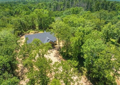 Relax and unwind at this peaceful 2-bedroom, 1-bath cabin off Hugo lake.