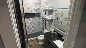 Shower, towels, soap, toilet paper