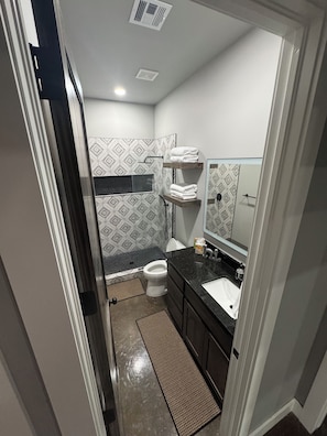 Shower, towels, soap, toilet paper