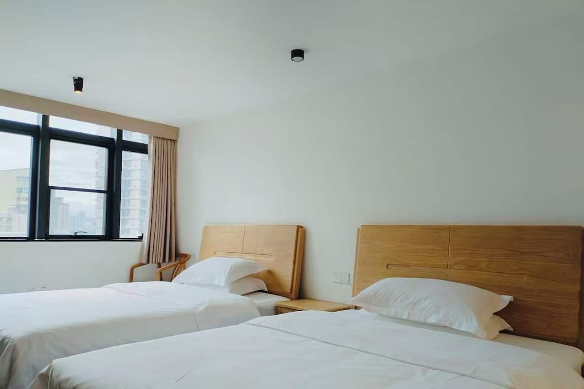 Chambre Élite avec lits jumeaux | Rideaux occultants, Wi-Fi gratuit, draps fournis