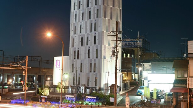 A modern building with a prominent sign at the top. - HOTEL LiVEMAX Nara Ekimae (Nara)