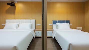 Deluxe Triple Room, City View | Premium bedding, individually decorated, individually furnished, desk