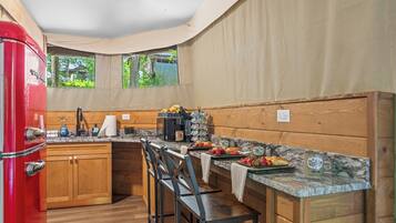 Fridge, microwave, coffee/tea maker, cookware/dishes/utensils