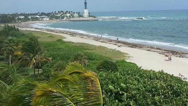 A coastal landscape with a beach, ocean, and a lighthouse. - Pompano Beach FL - Oceanfront Condos ~ 1 Bdrm $1399/Week, Studio $995/Week (Pompano Beach)