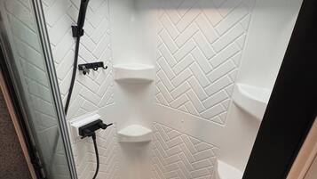 Shower, hair dryer, towels, soap