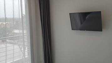 Apartment, Balcony | In-room safe, blackout curtains, iron/ironing board, free WiFi