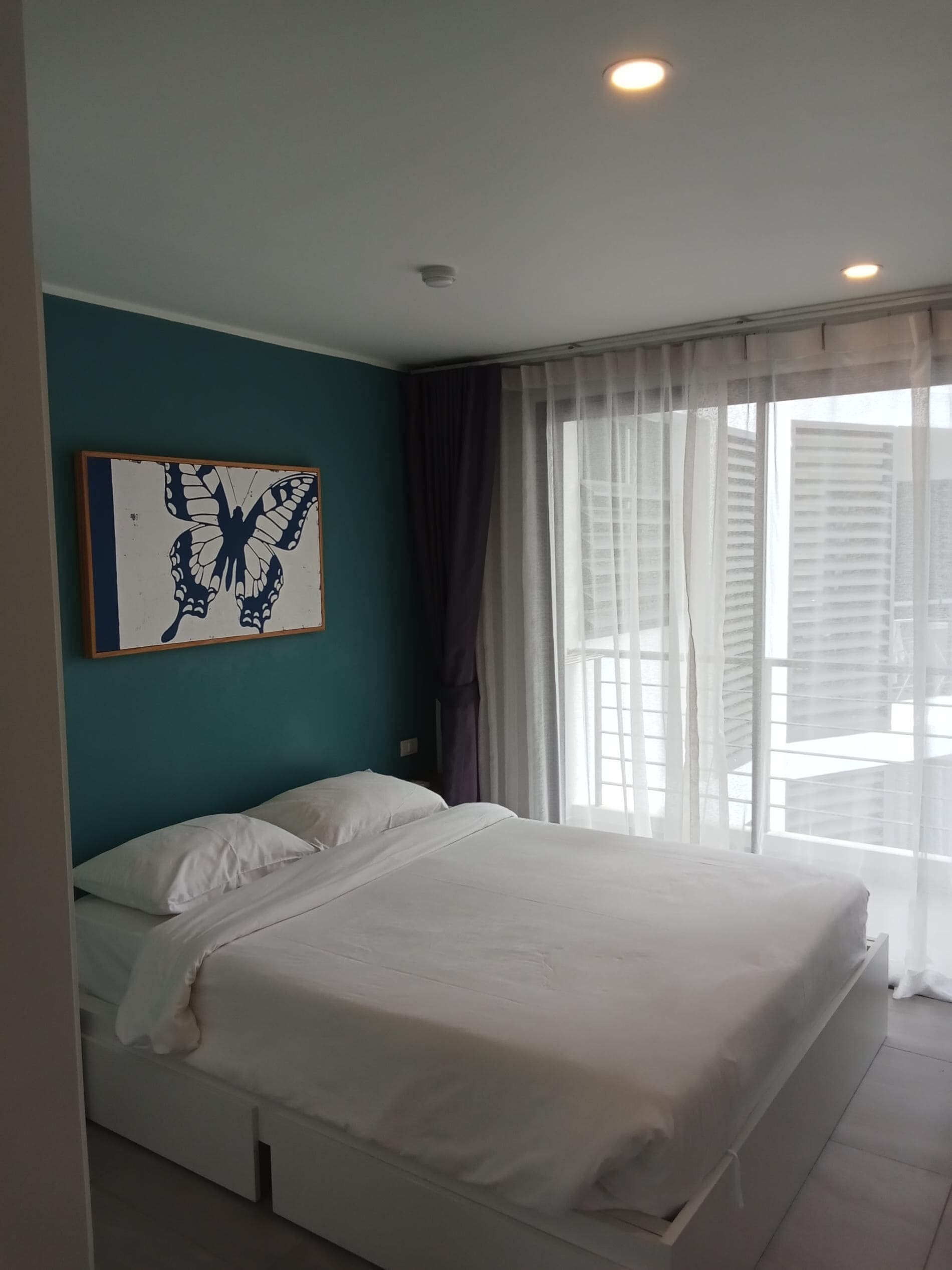 Apartamento, sacada | Cofres nos quartos, cortinas blackout, ferros/tábuas de passar roupa