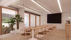 A modern conference room with a long table, wooden chairs, and large windows. - Lyf Bondi Junction Sydney (Bondi Junction)