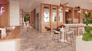 A modern interior with a stone floor, wooden furniture, and a bar area. - Lyf Bondi Junction Sydney (Bondi Junction)
