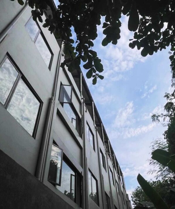 A modern building with large windows and a clear sky. - Shencasa Living Juanda (Sidoarjo)