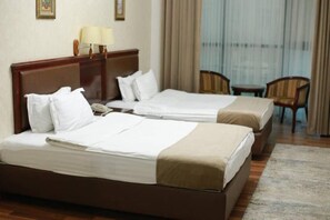 In-room safe, desk, laptop workspace, blackout drapes - Asia Grand Hotel (Dushanbe)