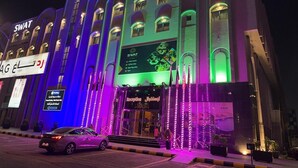 A hotel with a reception area and signage for SWAT services. - SWAT SERVICED APARTMENTS 5 (Al Khobar)
