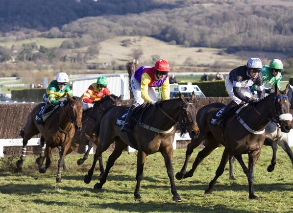 Jockeys on horses in a race.