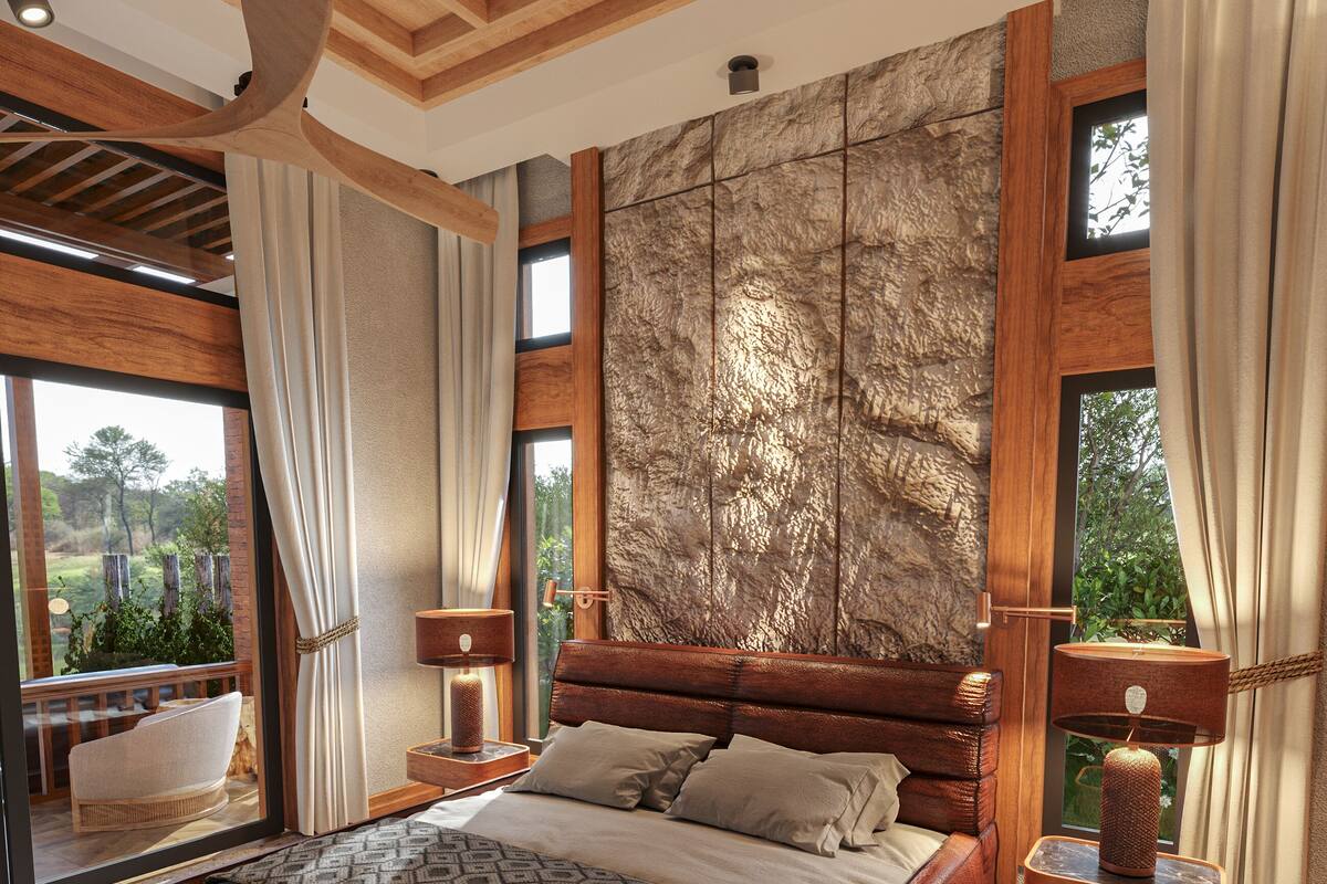 A spacious bedroom with a large bed, wooden headboard, and a view of the outdoors through large windows.