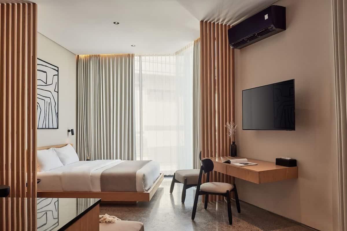 Premium Studio | Premium bedding, desk, laptop workspace, iron/ironing board