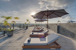 Outdoor pool, open 8:00 AM to 8:00 PM, pool umbrellas, pool loungers