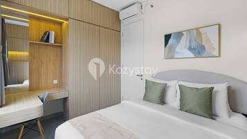 Apartment, 2 Bedrooms, Garden View | In-room safe, desk, laptop workspace, iron/ironing board