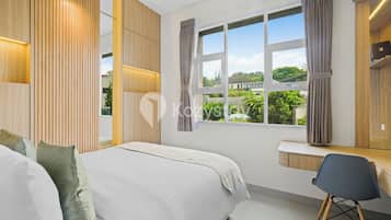 Apartment, 2 Bedrooms, Garden View | In-room safe, desk, laptop workspace, iron/ironing board