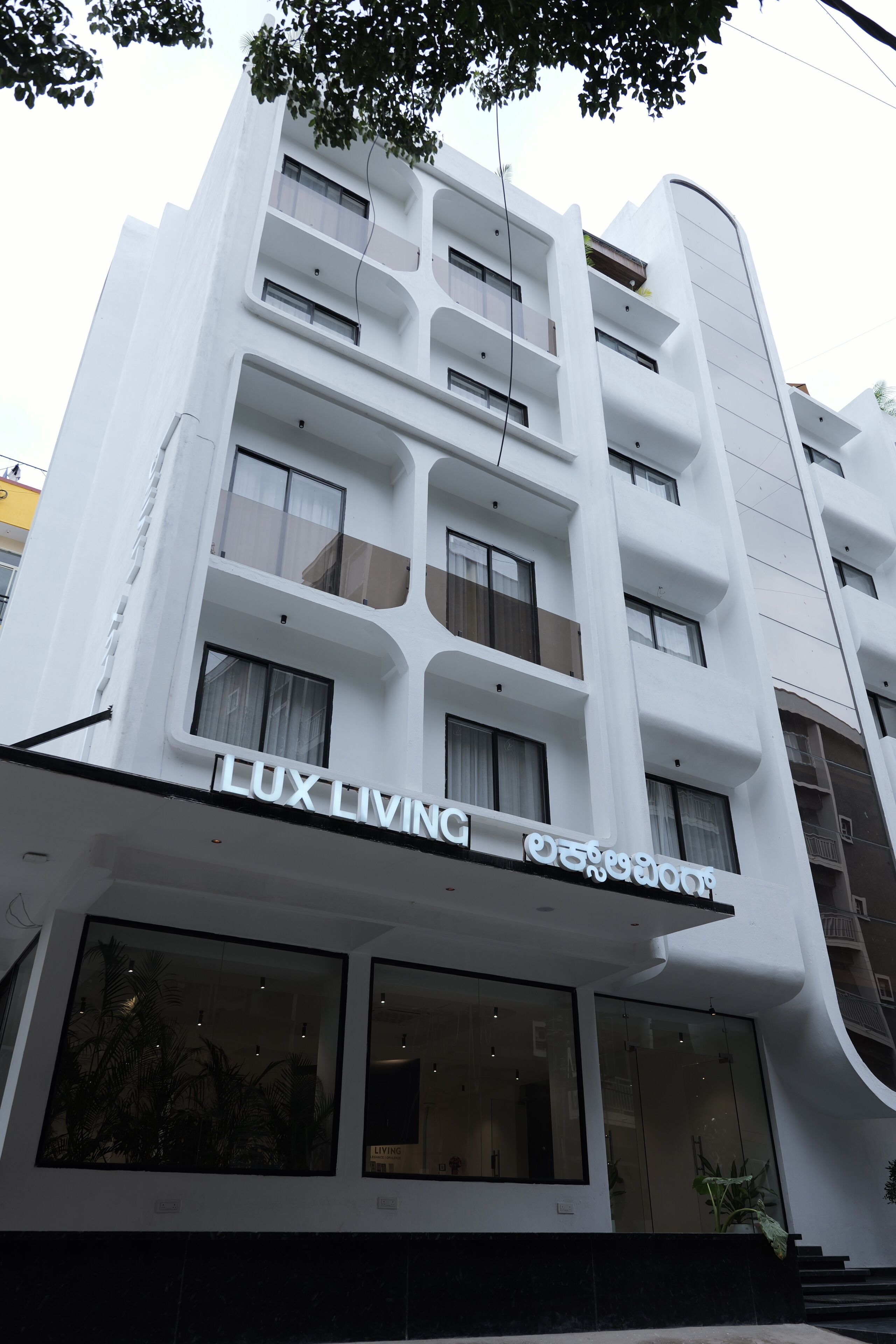 A modern building with a sign reading "LUX LIVING".