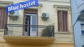 A building with a sign reading "Blue hostel" above the entrance. - Blue hostel (Buenos Aires)
