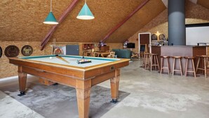 An indoor recreational area with a pool table, bar stools, and a dartboard. - 5 Star Holiday Home in Haderslev (Haderslev)