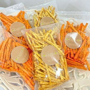 Several packages of seasoned fries in clear plastic bags with labels. - Home Suite Home Singkawang (Singkawang)