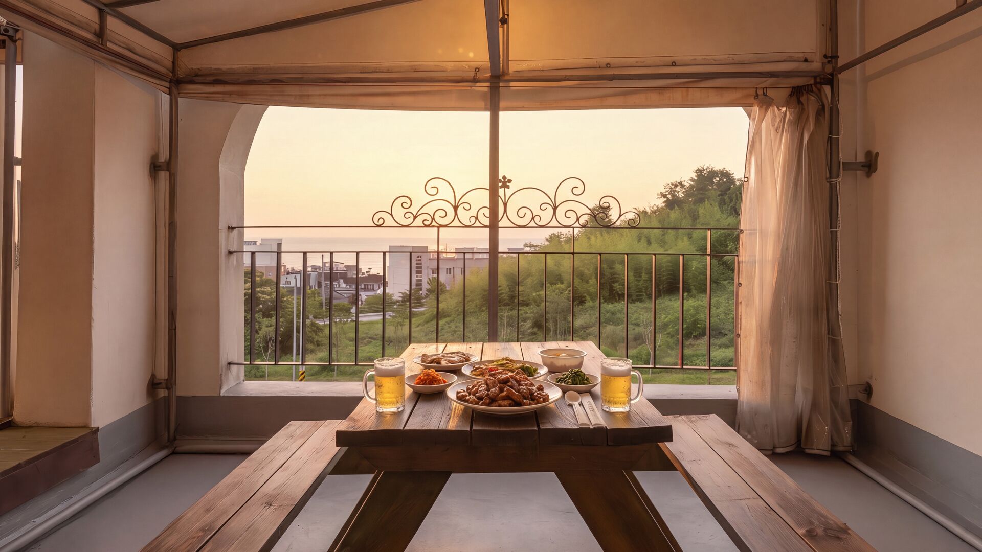 A balcony with a table set for dining, featuring a variety of dishes and a beer mug.