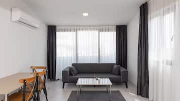 Standard Apartment | Living area | 43-inch TV with satellite channels, Netflix, streaming services