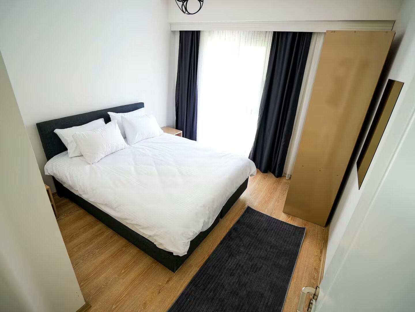 Desk, laptop workspace, blackout drapes, soundproofing