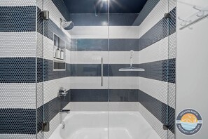 Shower, hair dryer, towels, shampoo