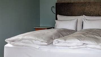 Premium bedding, down duvets, individually decorated
