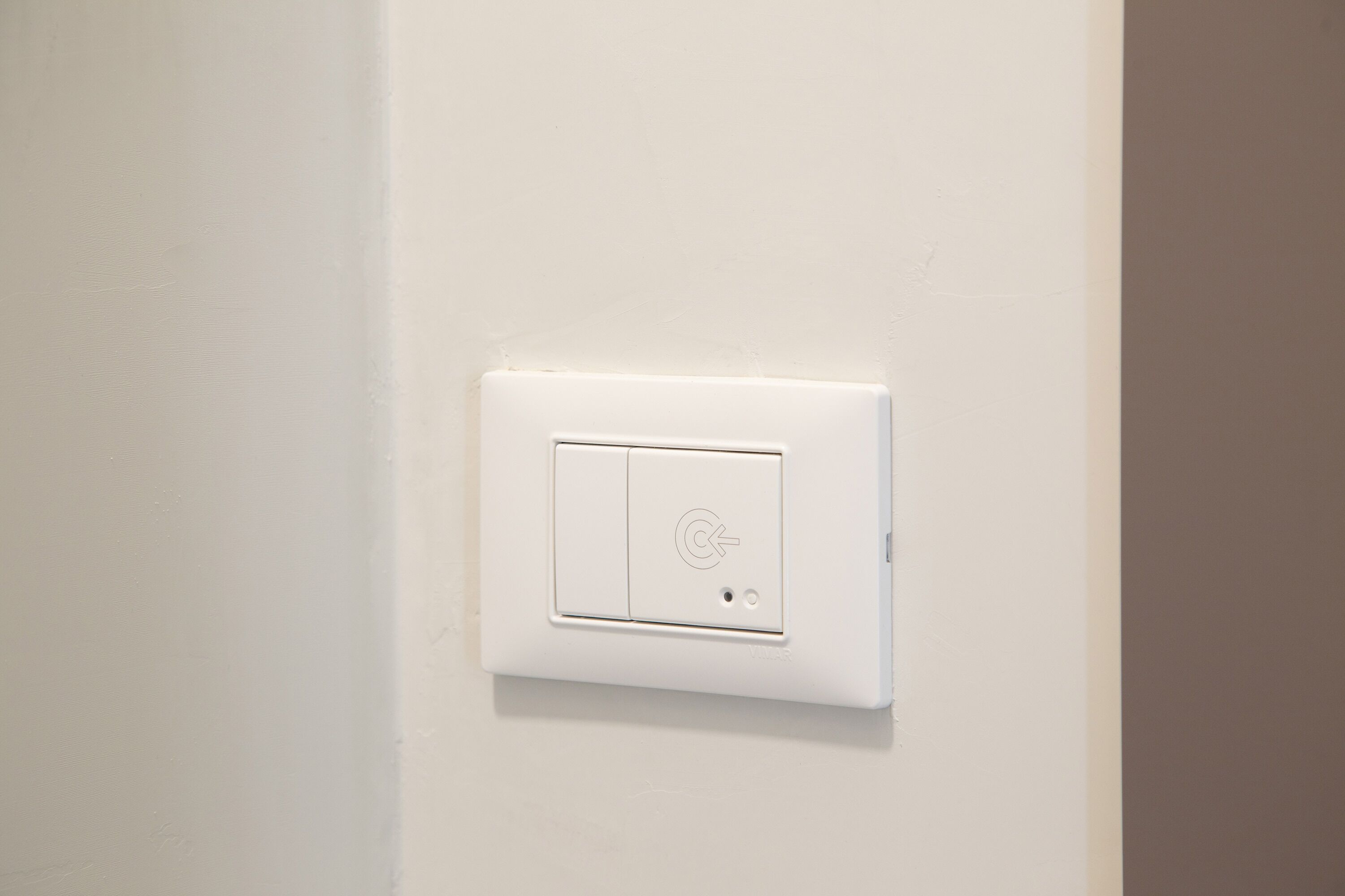 A white wall-mounted switch.