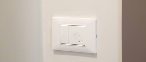 A white wall-mounted switch.