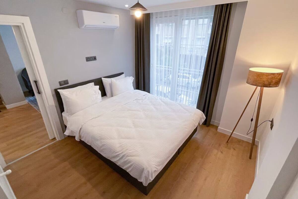 Standard Apartment, 1 Bedroom | Desk, laptop workspace, soundproofing, iron/ironing board