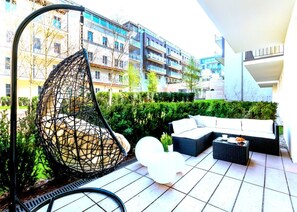 Suite – exclusive, hageutsikt | Terrasse/patio