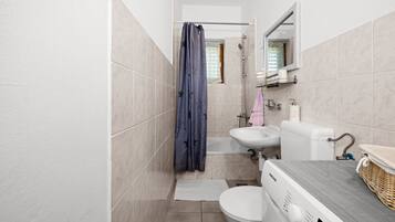 Shower, hair dryer, towels