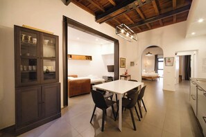 A modern interior with a dining area, kitchen, and living space.