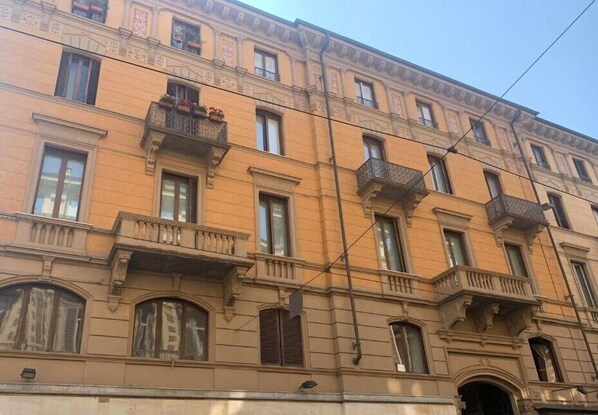 A multi-story building with balconies and large windows. - SUYTE Torino Centro (Turin)