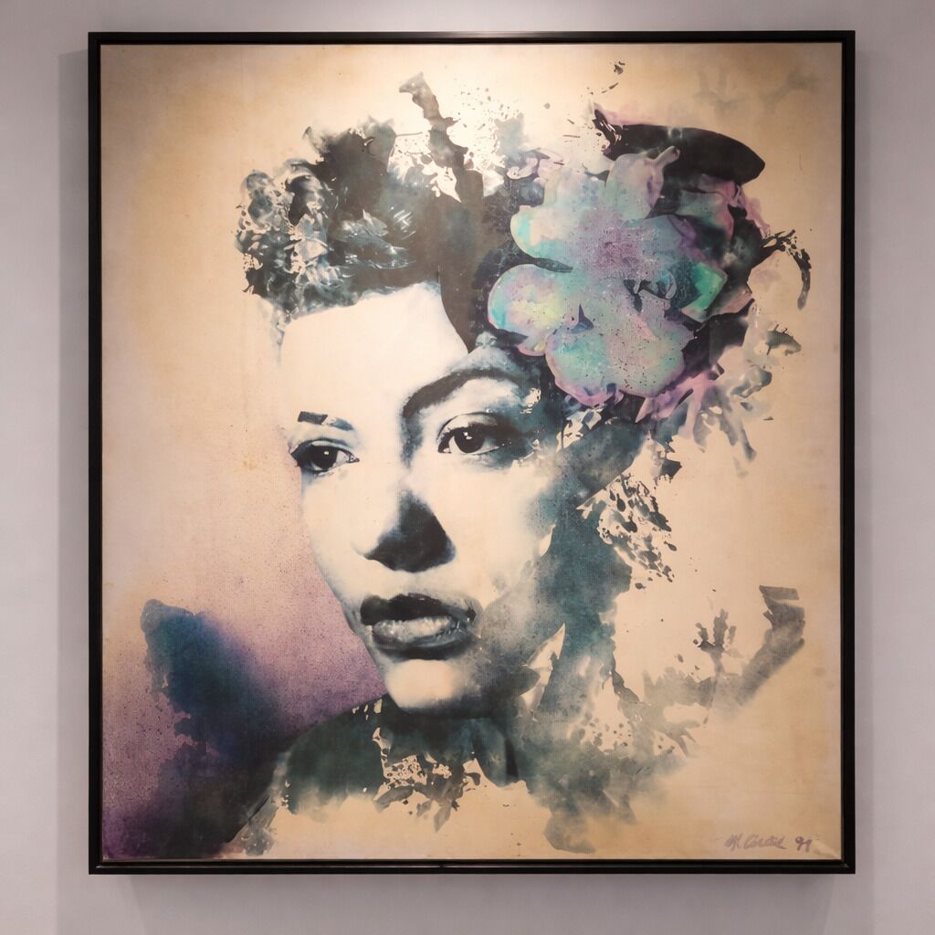 A framed artwork with abstract and colorful elements.