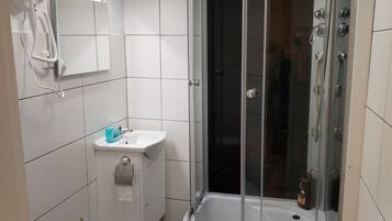 Shower, free toiletries, hair dryer, towels