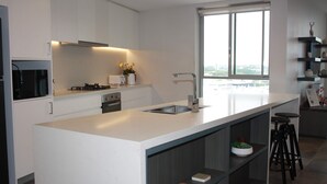 Coffee/tea maker, fridge, microwave, oven - Sydney Skyline Penthouse | 2 Parking, City Views CBD Airport (Mascot)