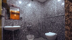 A bathroom with a sink, toilet, and shower. - Le Kumar Residency (Puducherry)