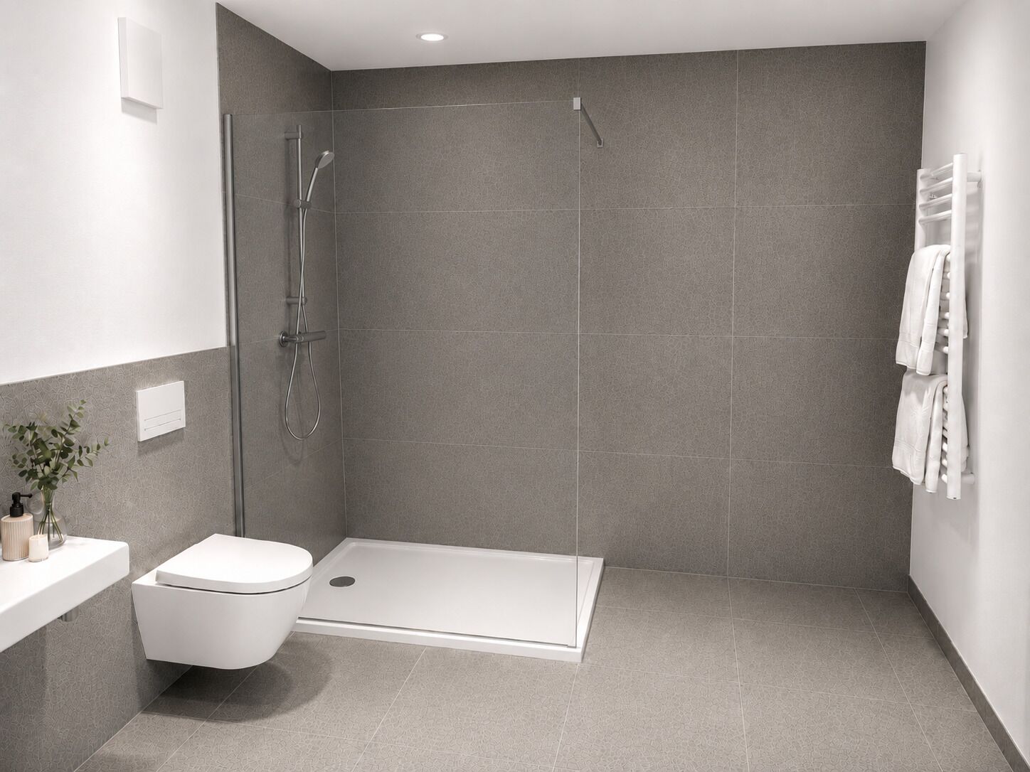 Un baño moderno con ducha, inodoro y lavamanos blanco.