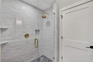 Shower, hair dryer, towels, shampoo